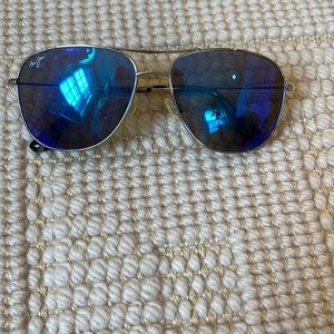 Maui Jim sunglasses with blue/green lenses and silver frame